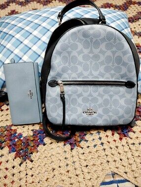 coach backpack purse white Coach X Observed By Us Court Printed coated canvas and refined pebble leather Inside zip and multifunction pockets Double zip closure fabric lining Handle with 2 1/4 drop Outside zip pocket Adjustable shoulder straps 10 3/4 (L) x 12 1/2 (H) x 4 3/4 (W) Style No. Coach | Bags | Coach